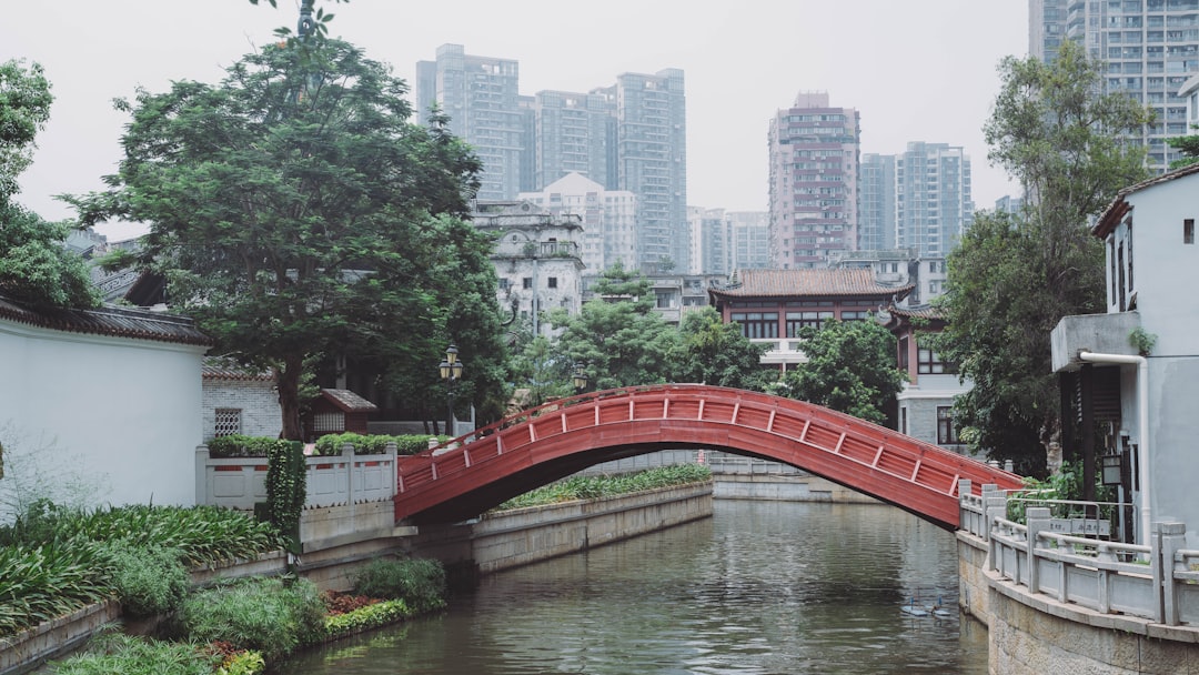 red bridge over river during daytime