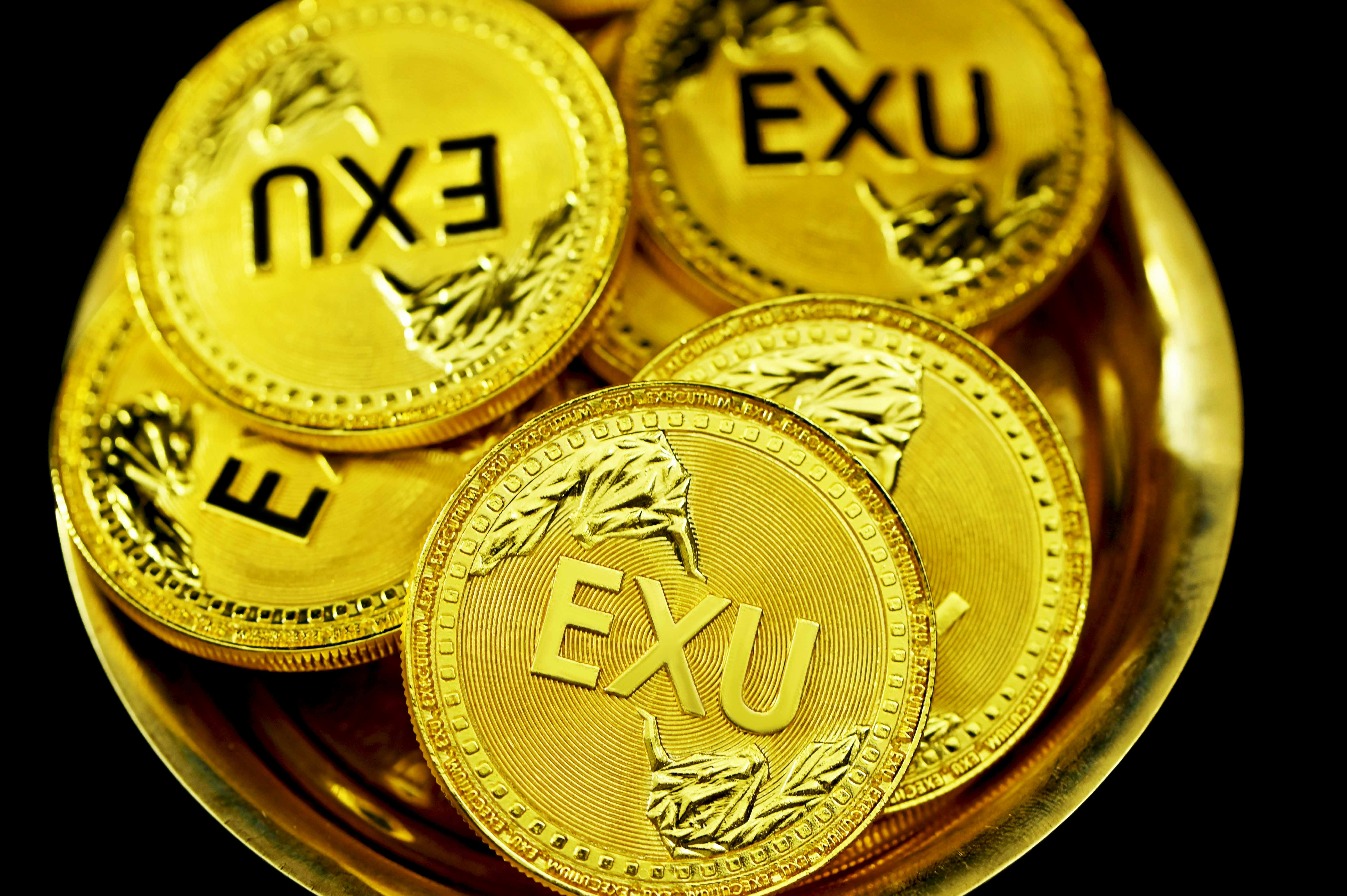 EXU coins in a golden bowl