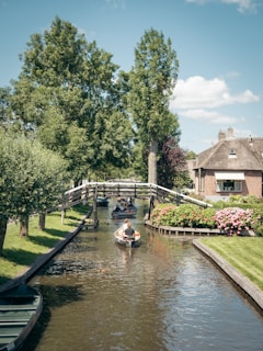 people riding on boat on river during daytime