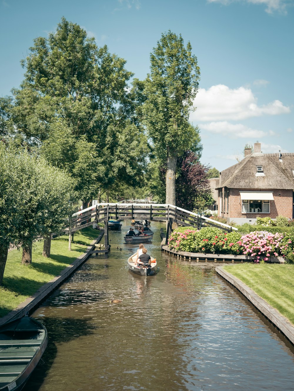 people riding on boat on river during daytime