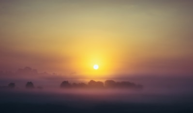 body of water during sunset
