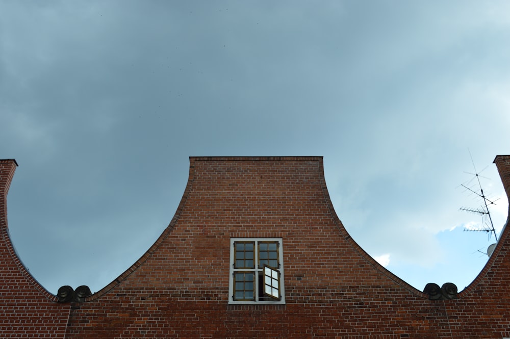 brown brick building under gray sky