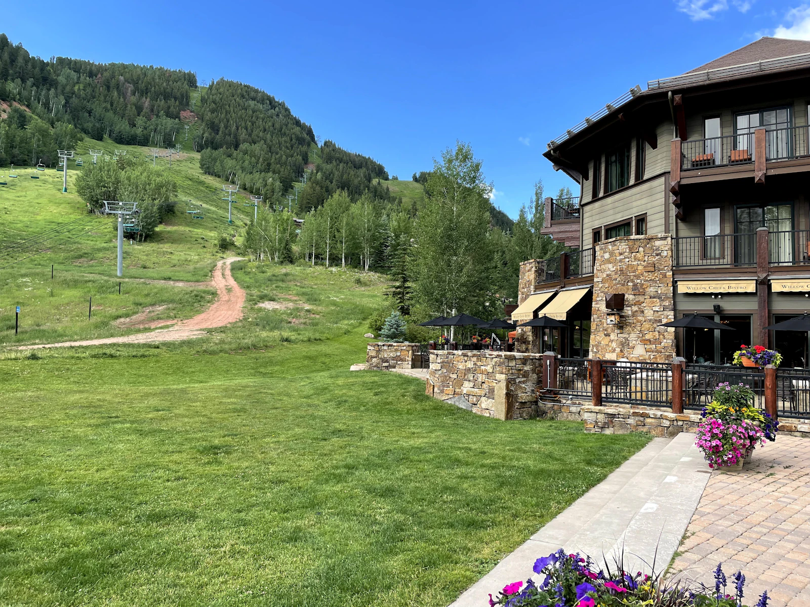 Snowmass Village beside green summer ski slopes