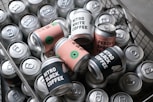 a shopping cart filled with cans of coffee