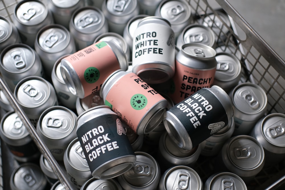 a shopping cart filled with cans of coffee