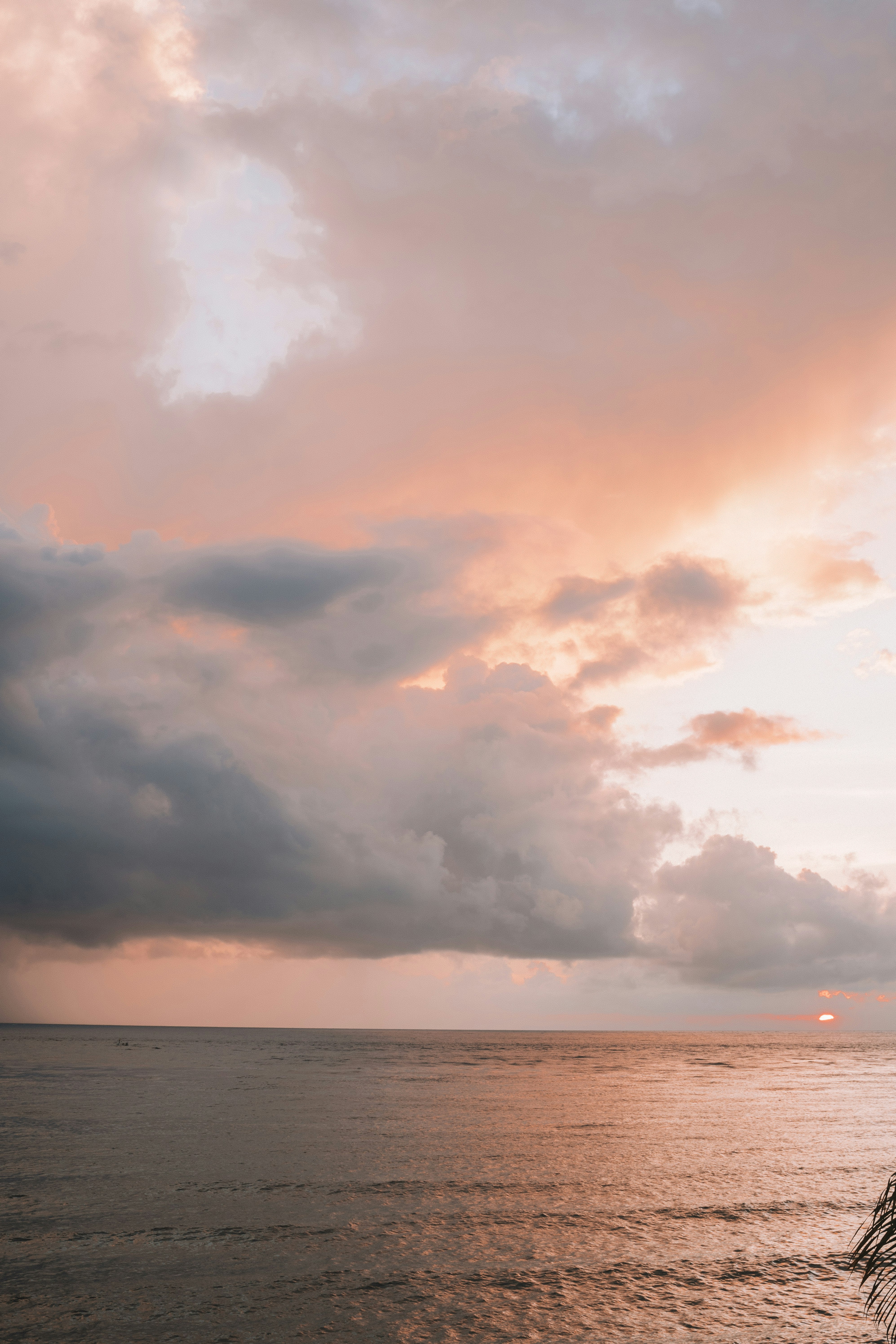 body of water under cloudy sky during daytime