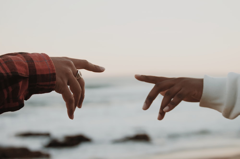 a hand holding a water bottle