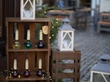 An outdoor scene with elroxy bottles arranged on a wooden table against a warm, golden hour backdrop.
