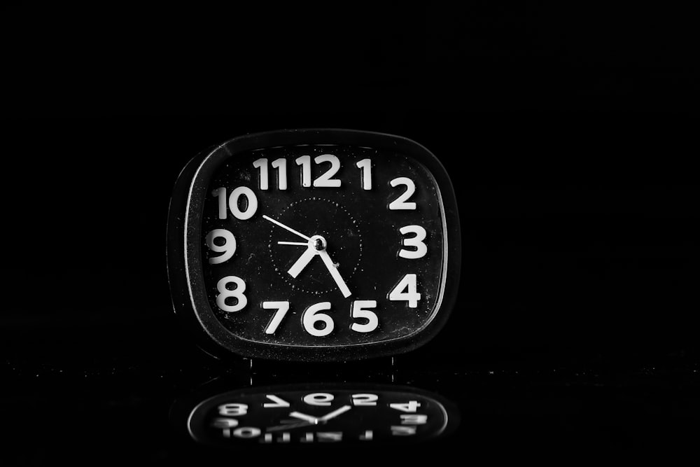 black and white analog clock