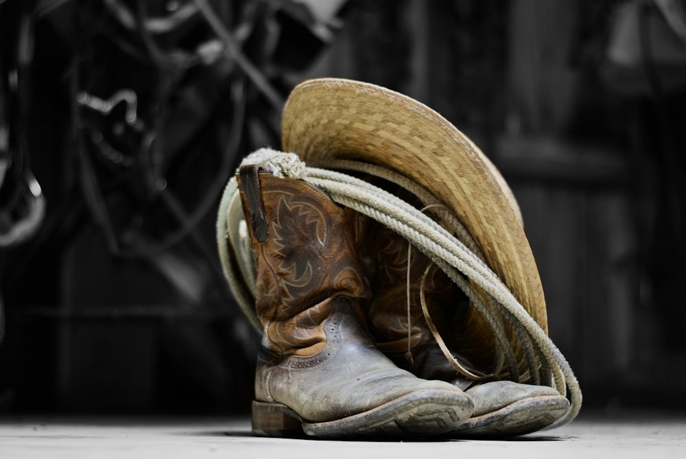 brown cowboy boots on white textile