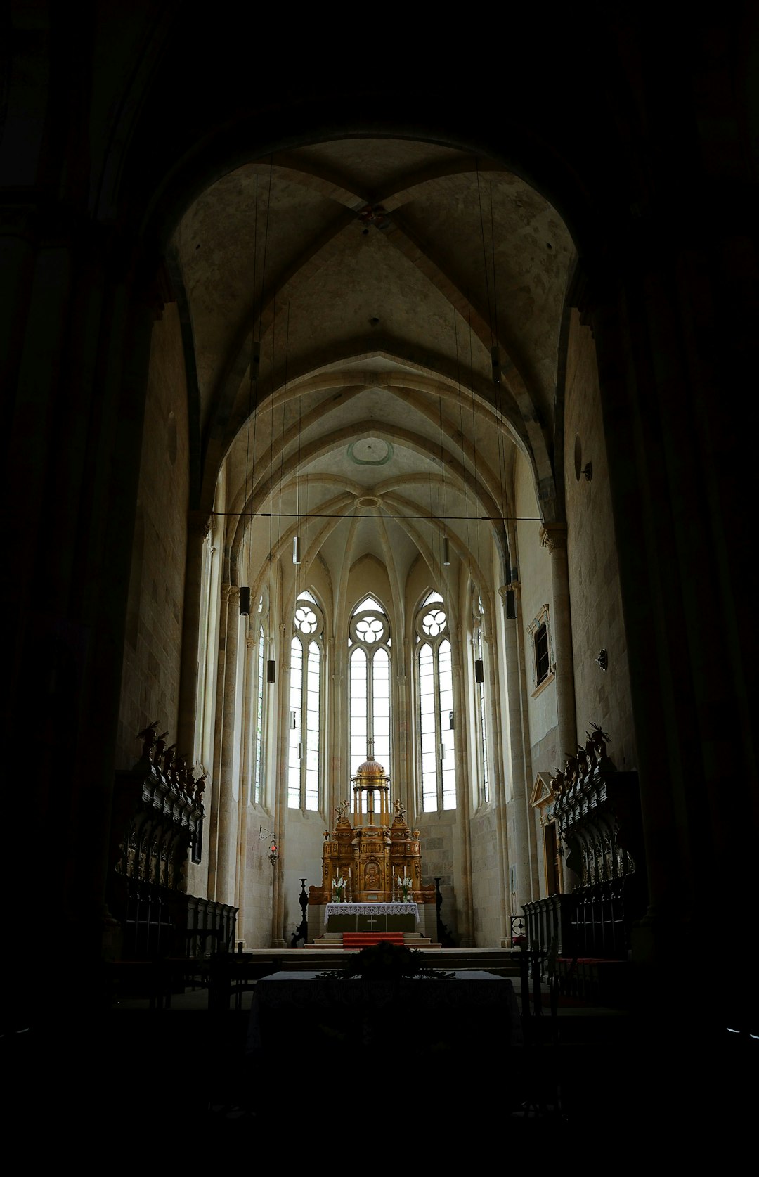 brown wooden bench inside cathedral