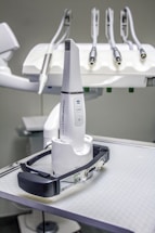 a white robot sitting on top of a table