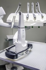 a white robot sitting on top of a table