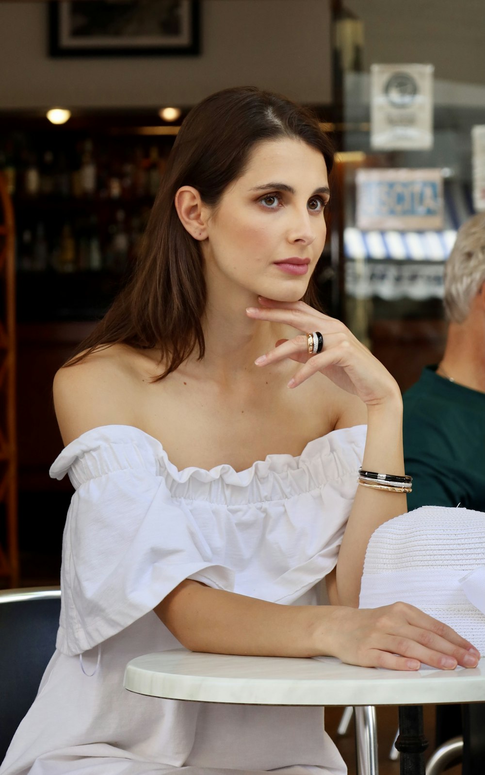 woman in white off shoulder dress