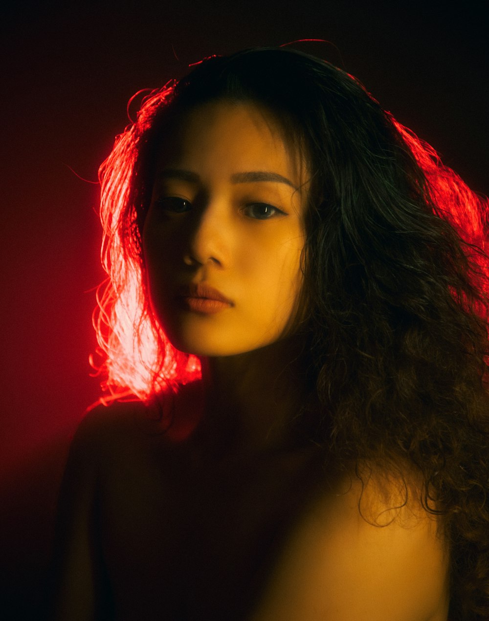 woman with red hair and black eyes