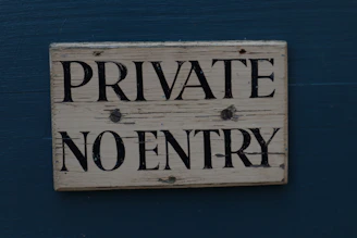 brown wooden welcome to the beach signage