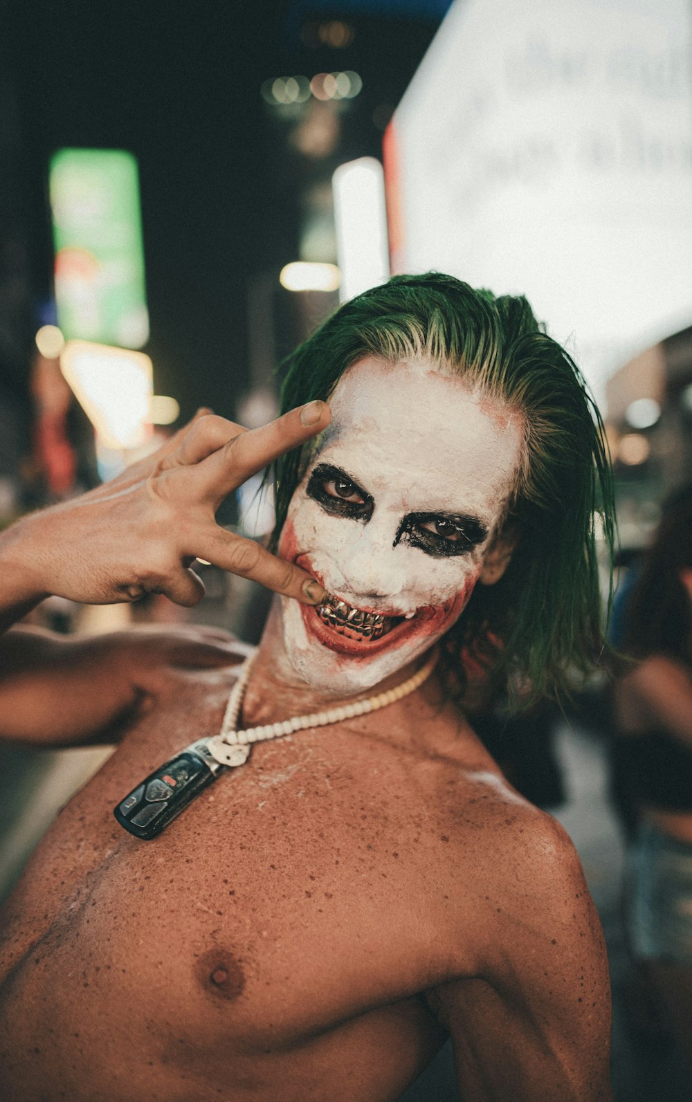 topless woman with white face paint