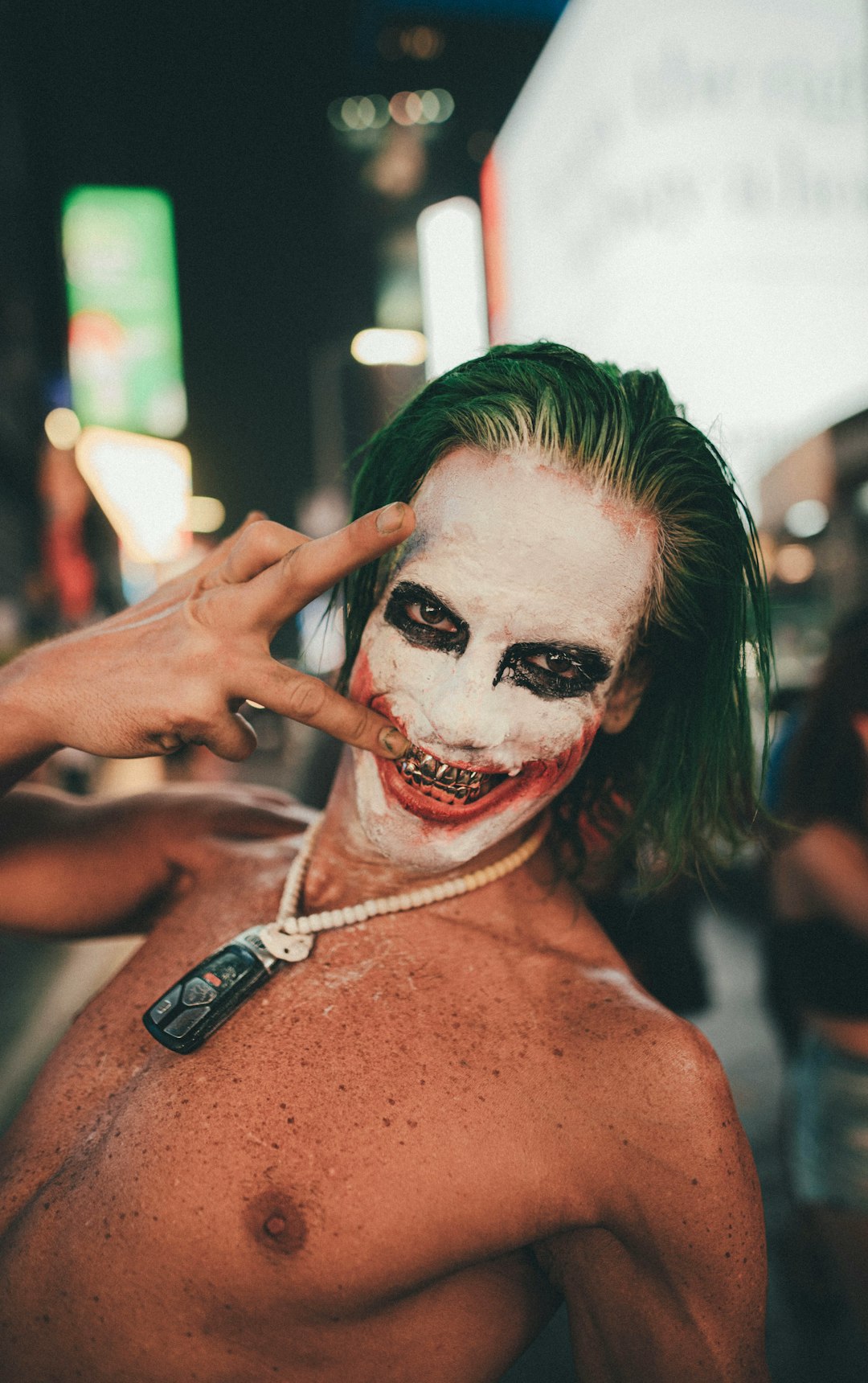 topless woman with white face paint