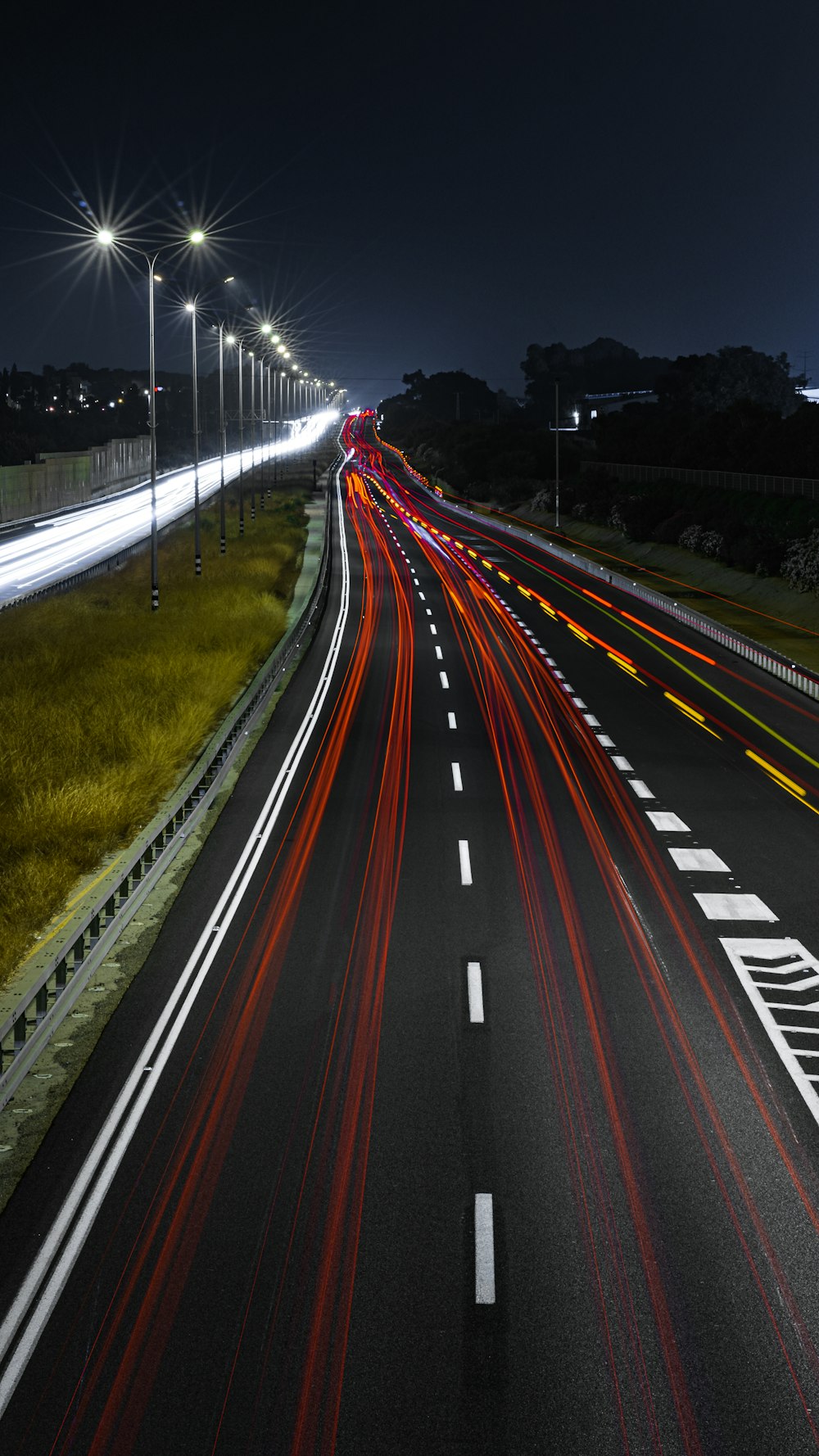 time lapse photography of cars on road during night time