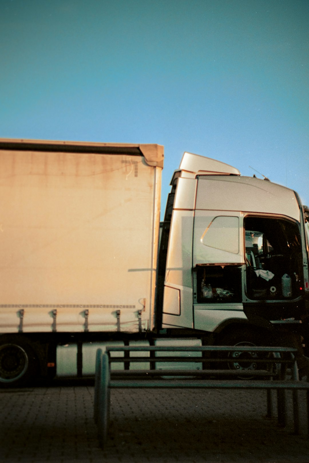 white truck with brown cardboard box