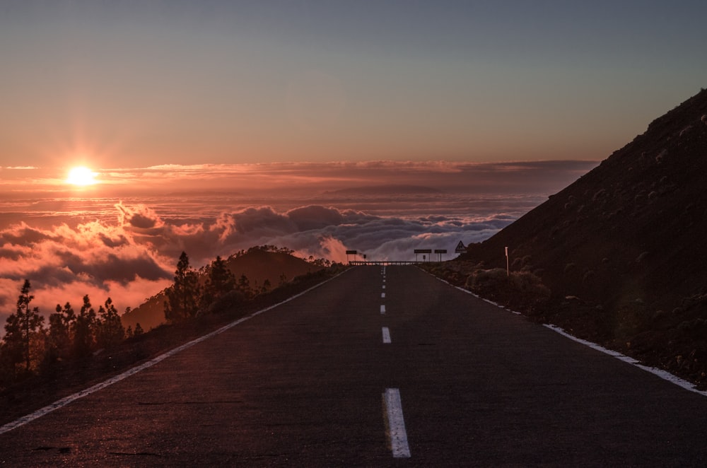 gray concrete road during sunset