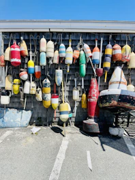 red yellow and green glass bottles on black metal rack