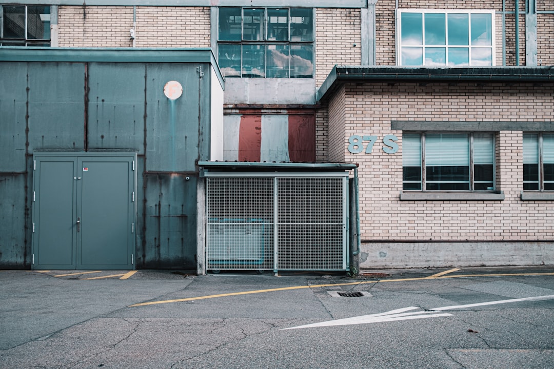 red brick building with black metal gate