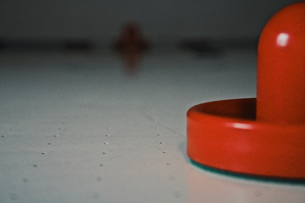 brown round plastic lid on blue surface