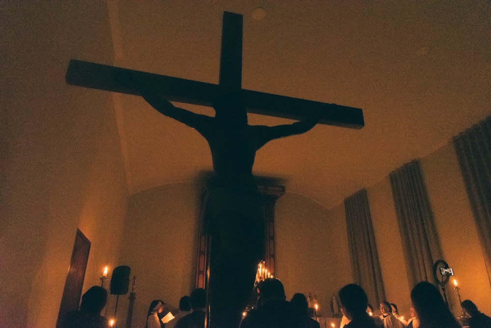 silhouette of cross on wall