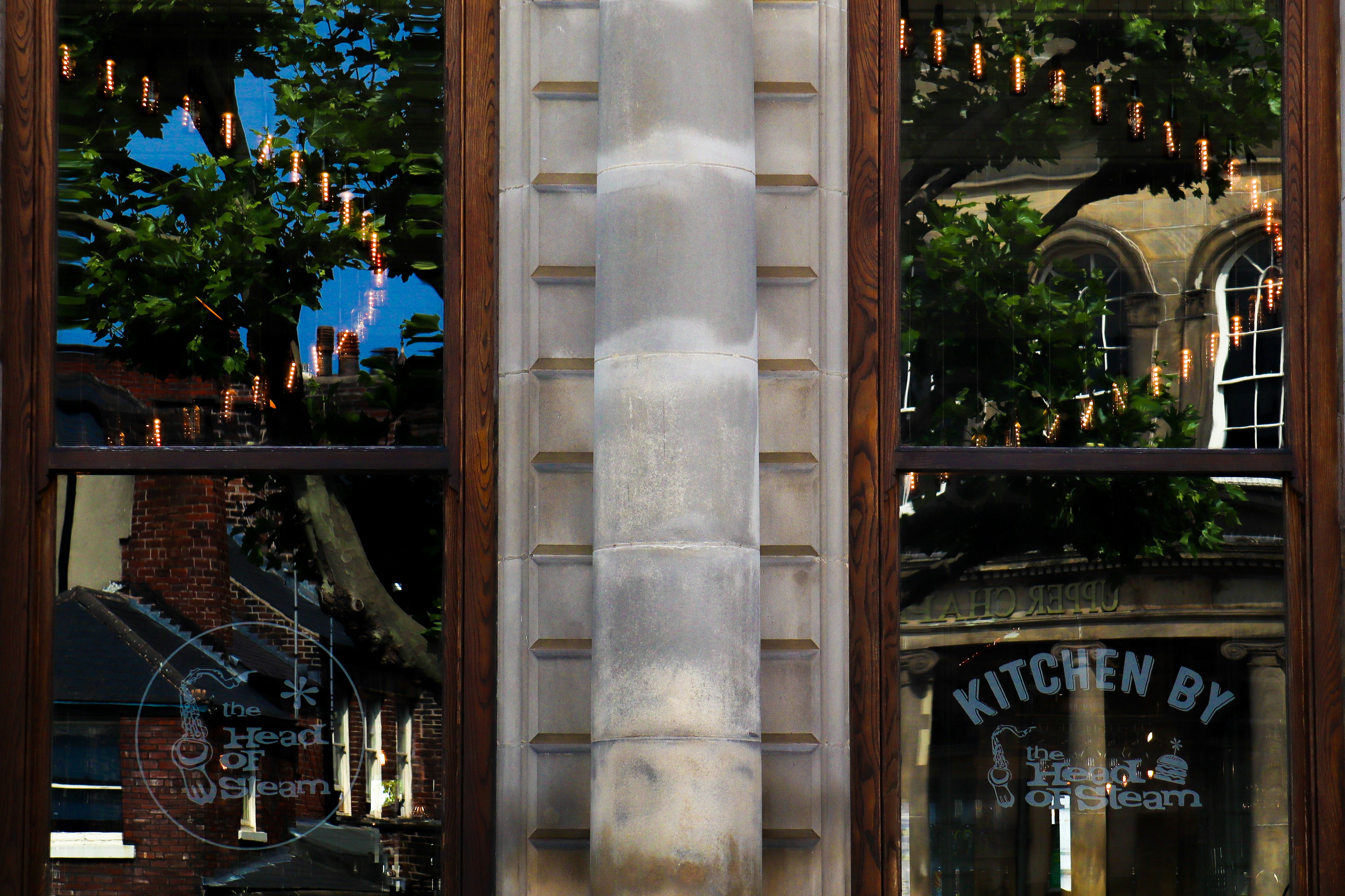 brown wooden framed glass window