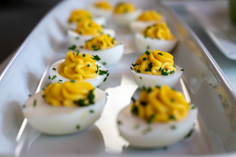 white and yellow icing covered cupcakes
