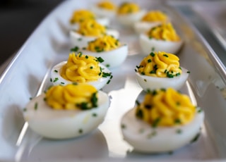 white and yellow icing covered cupcakes