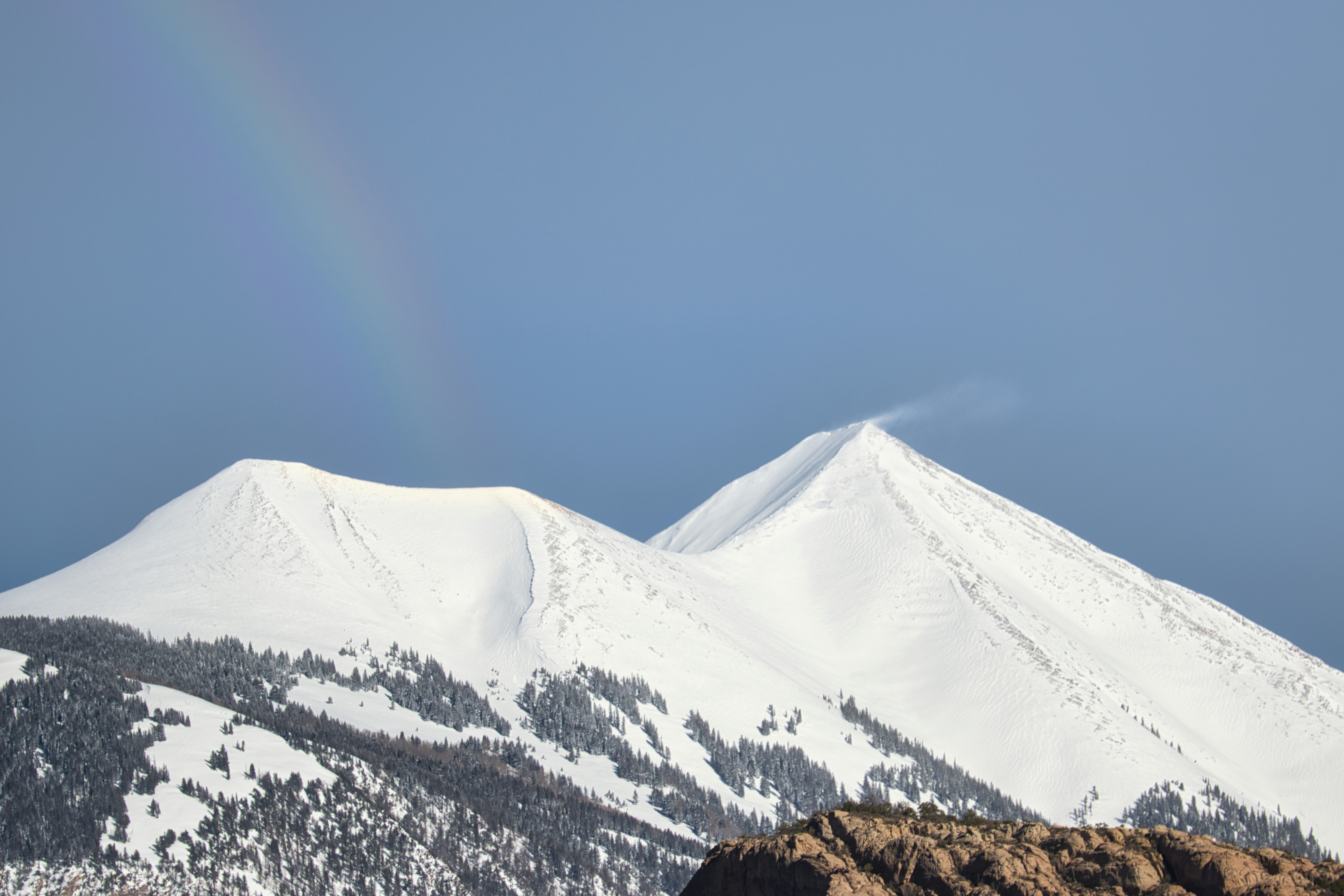 snow covered mountain under blue sky during daytime