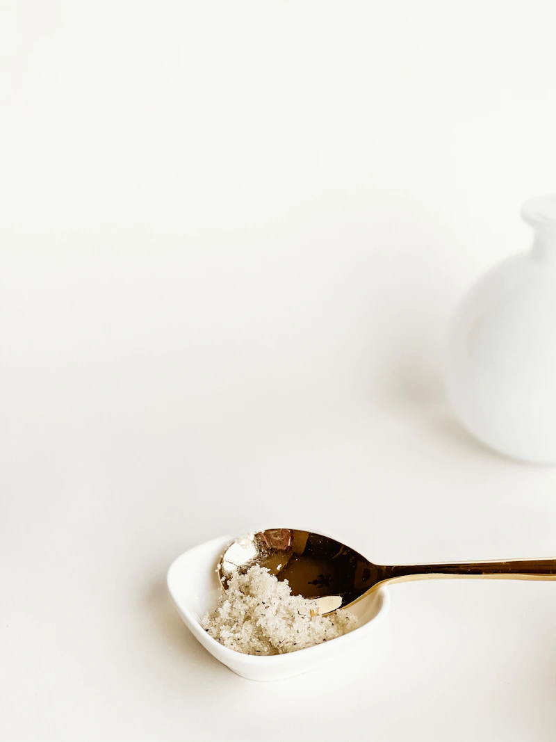 White ceramic teapot on a white ceramic bowl