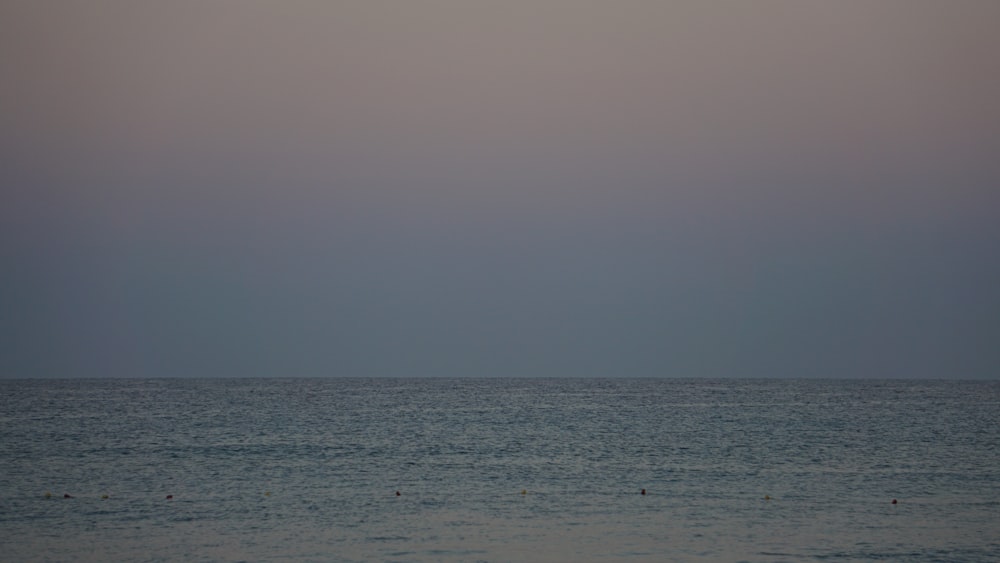 body of water under gray sky