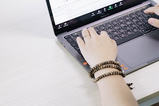 person using black and silver laptop computer