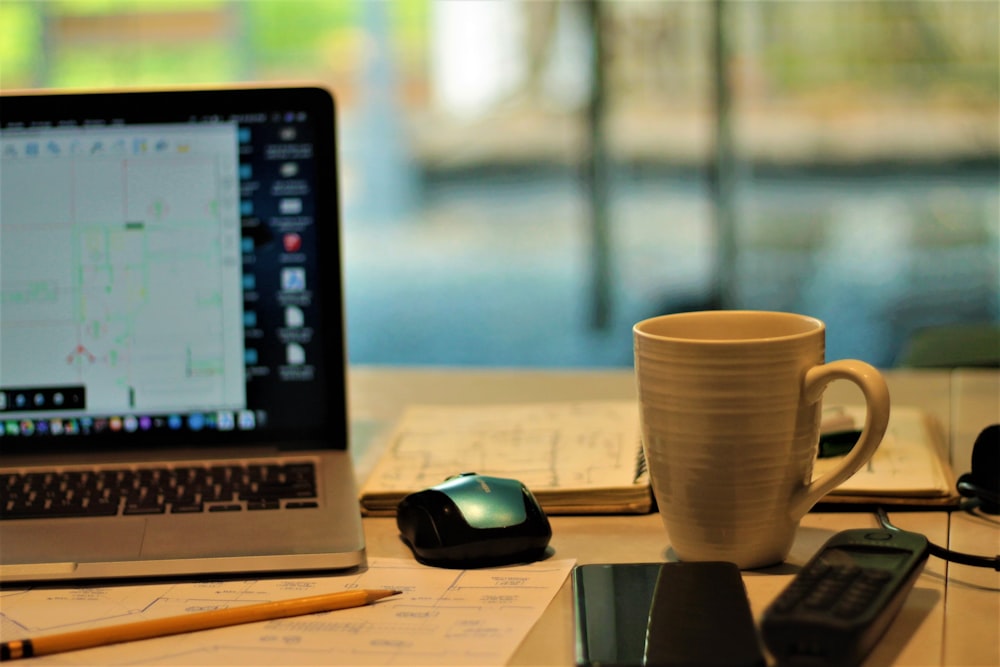 Workspace with laptop and financial documents