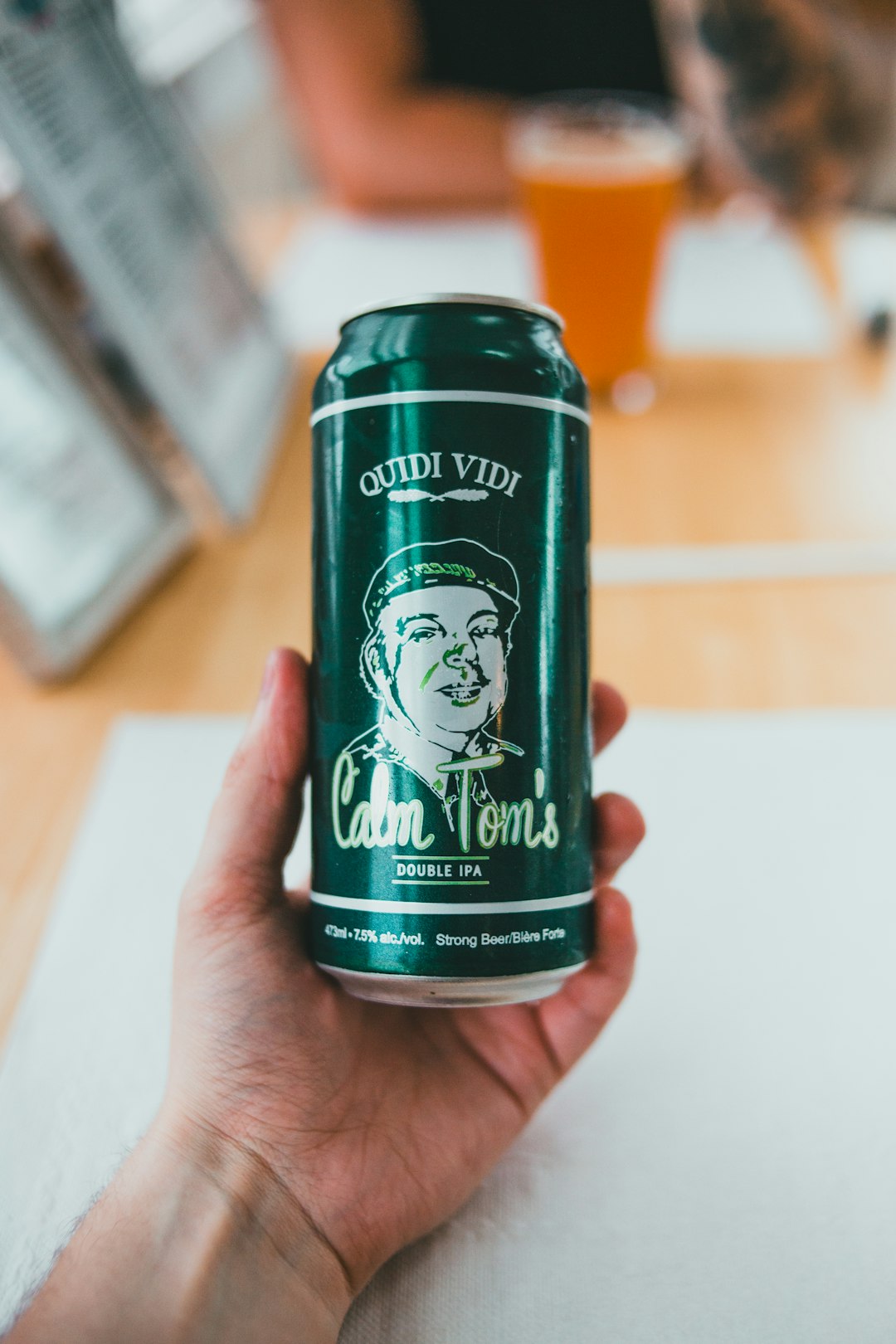 green and white labeled can