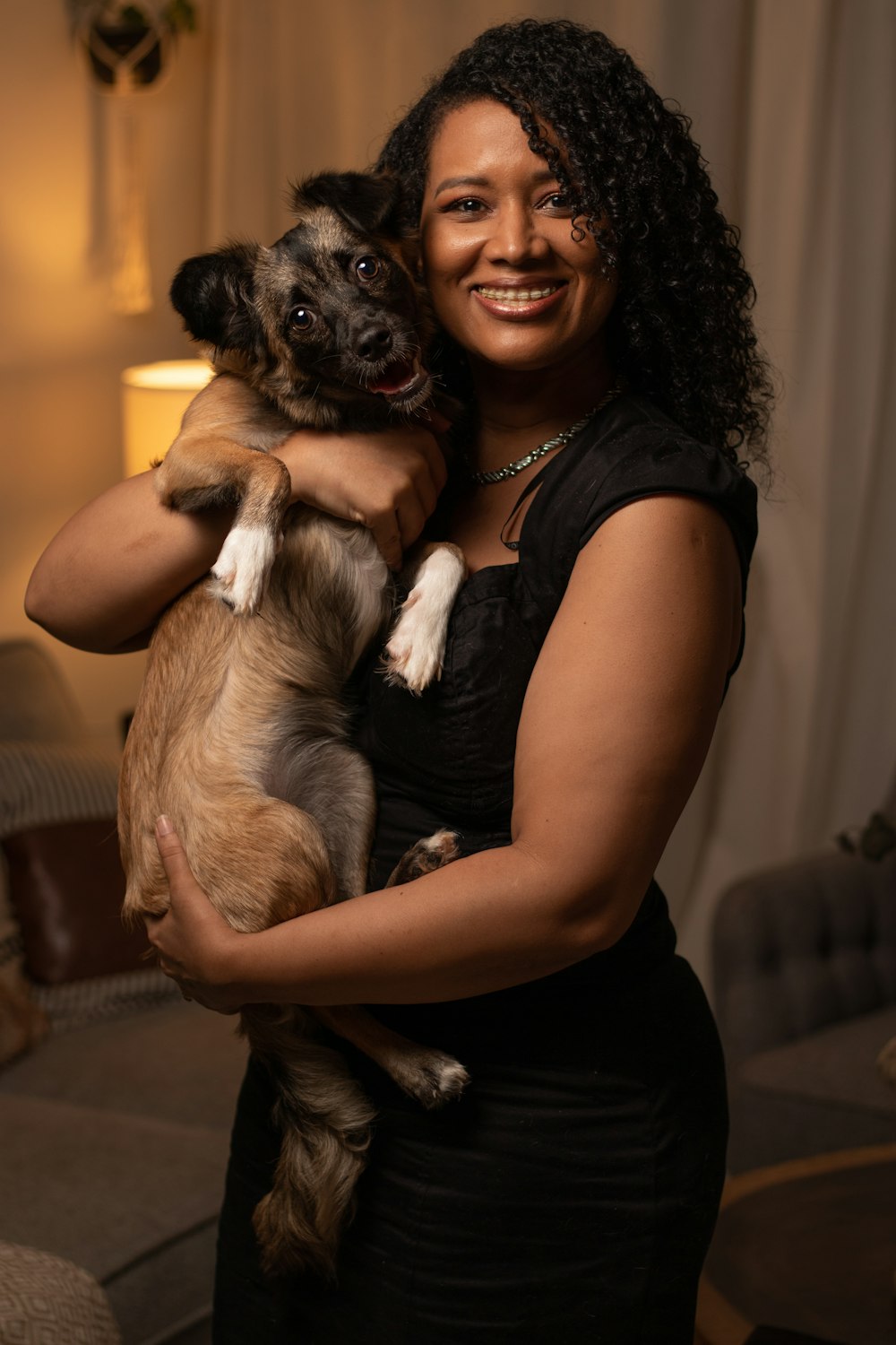 Woman in black tank top holding brown and black short coated small dog  photo – Free Animal Image on Unsplash