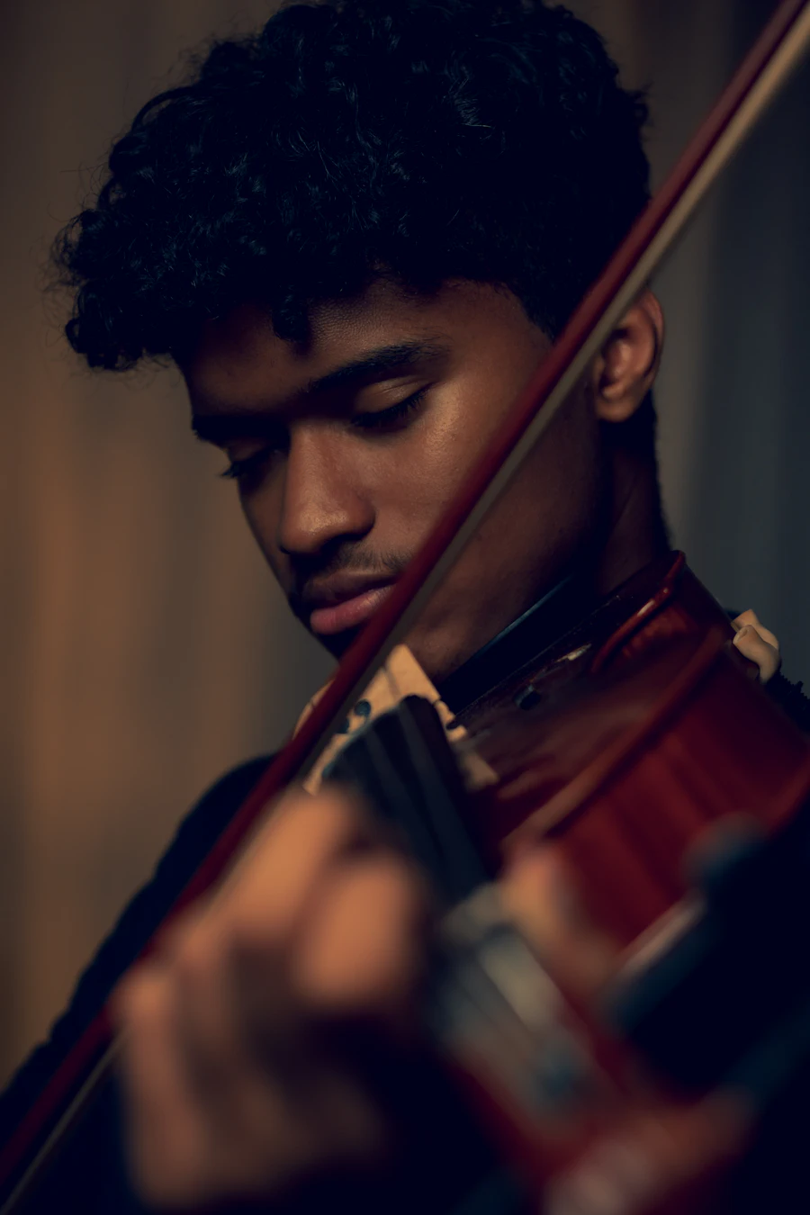 Musician absorbed in viola practice &mdash; focused private viola instruction and orchestra audition preparation