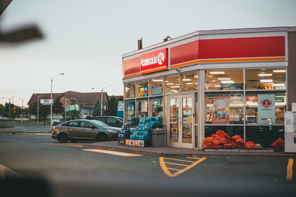 cars parked in front of store during daytime