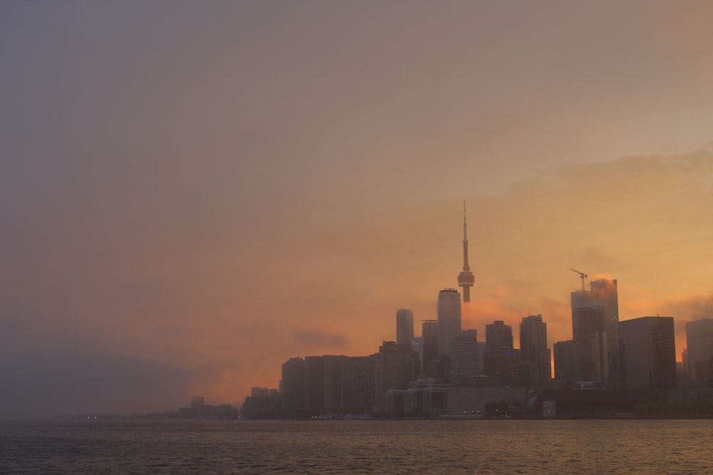 silhouette of city buildings during sunset