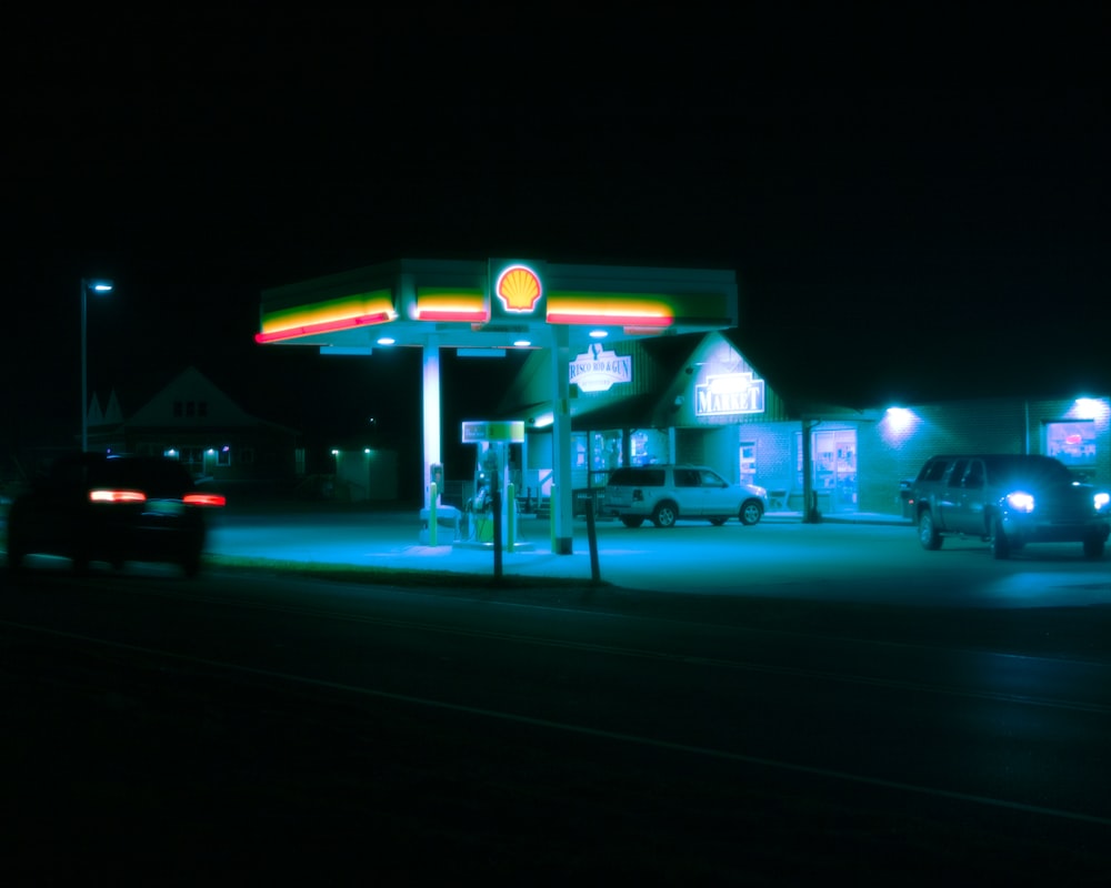 white and green store front during night time