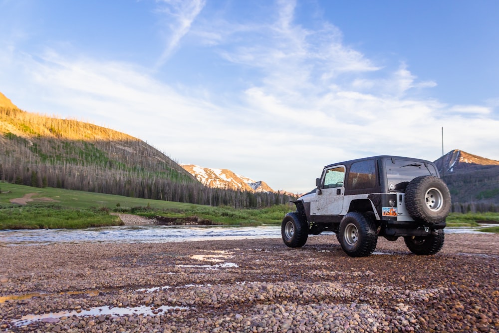 black jeep wrangler on dirt road during daytime