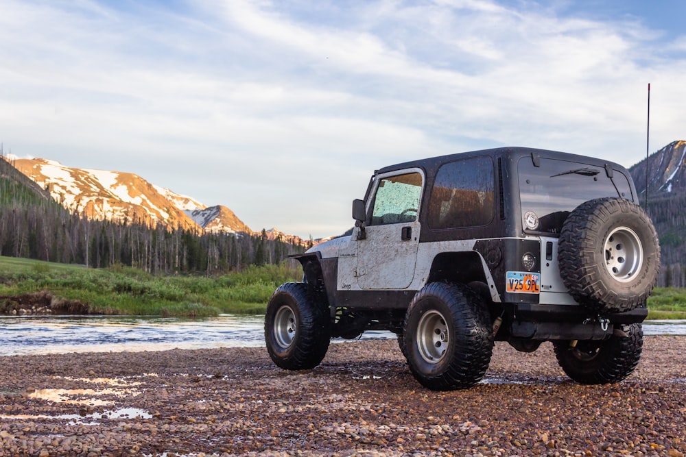 black jeep wrangler on dirt road during daytime