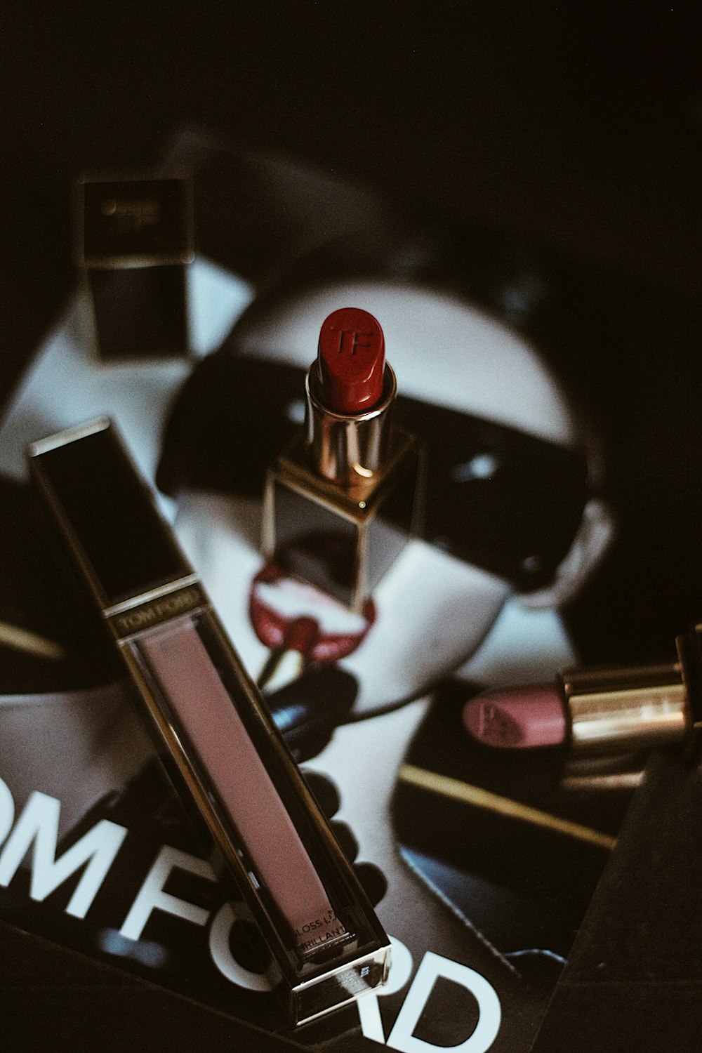 red lipstick beside red lipstick