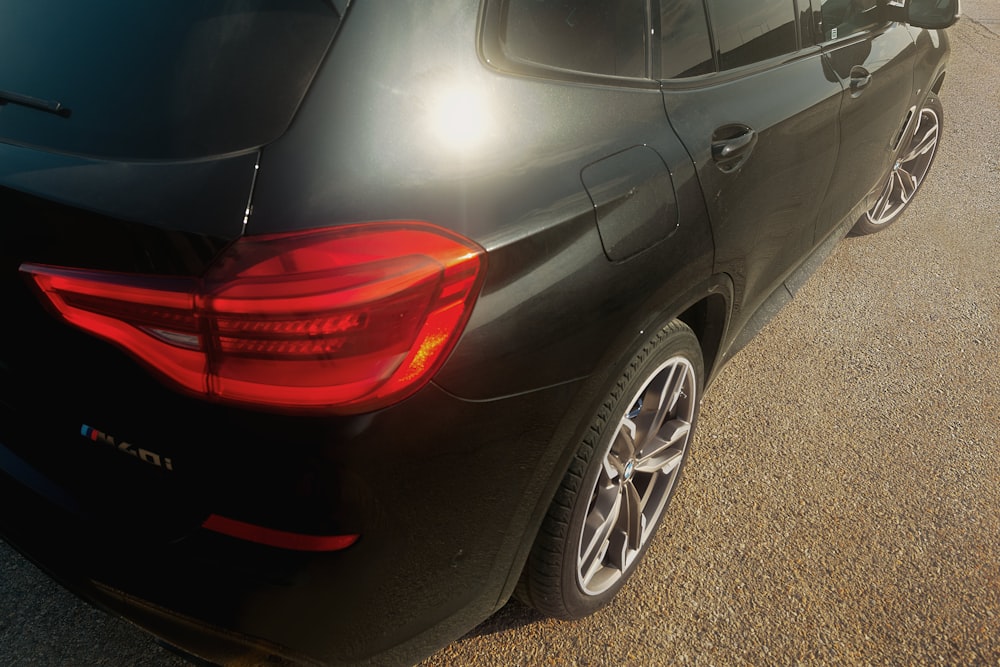 black car on gray asphalt road