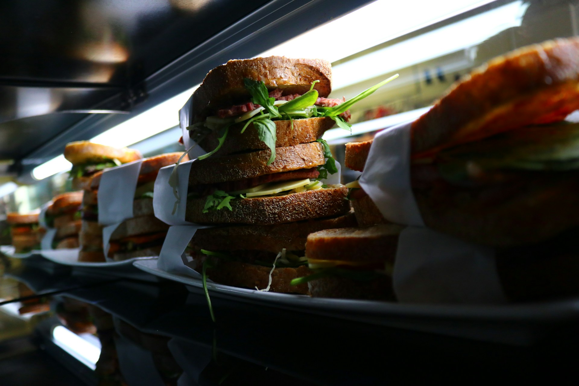 woman wearing yellow long-sleeved dress under white clouds and blue sky during daytime