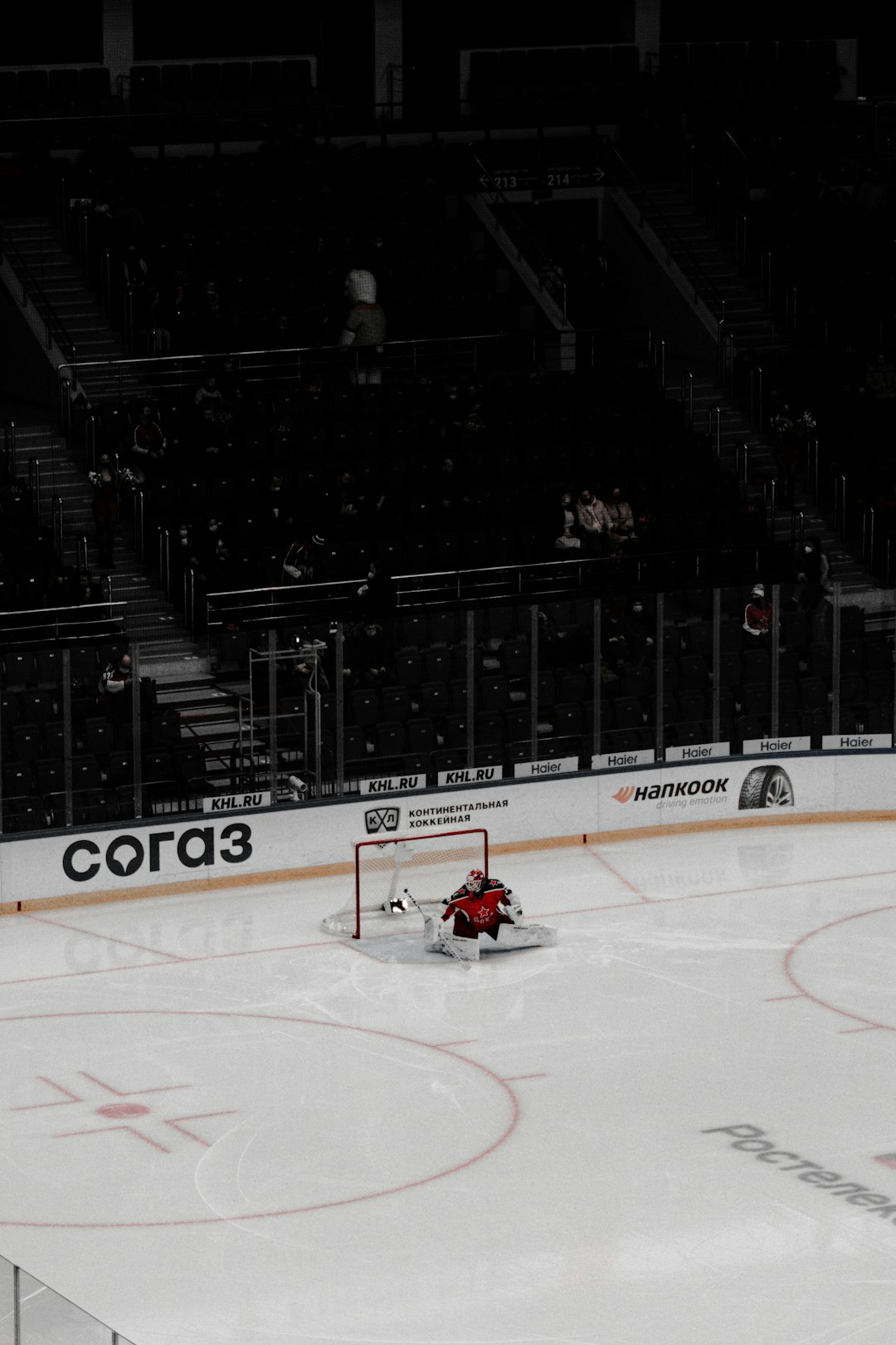 people riding red go kart on ice stadium