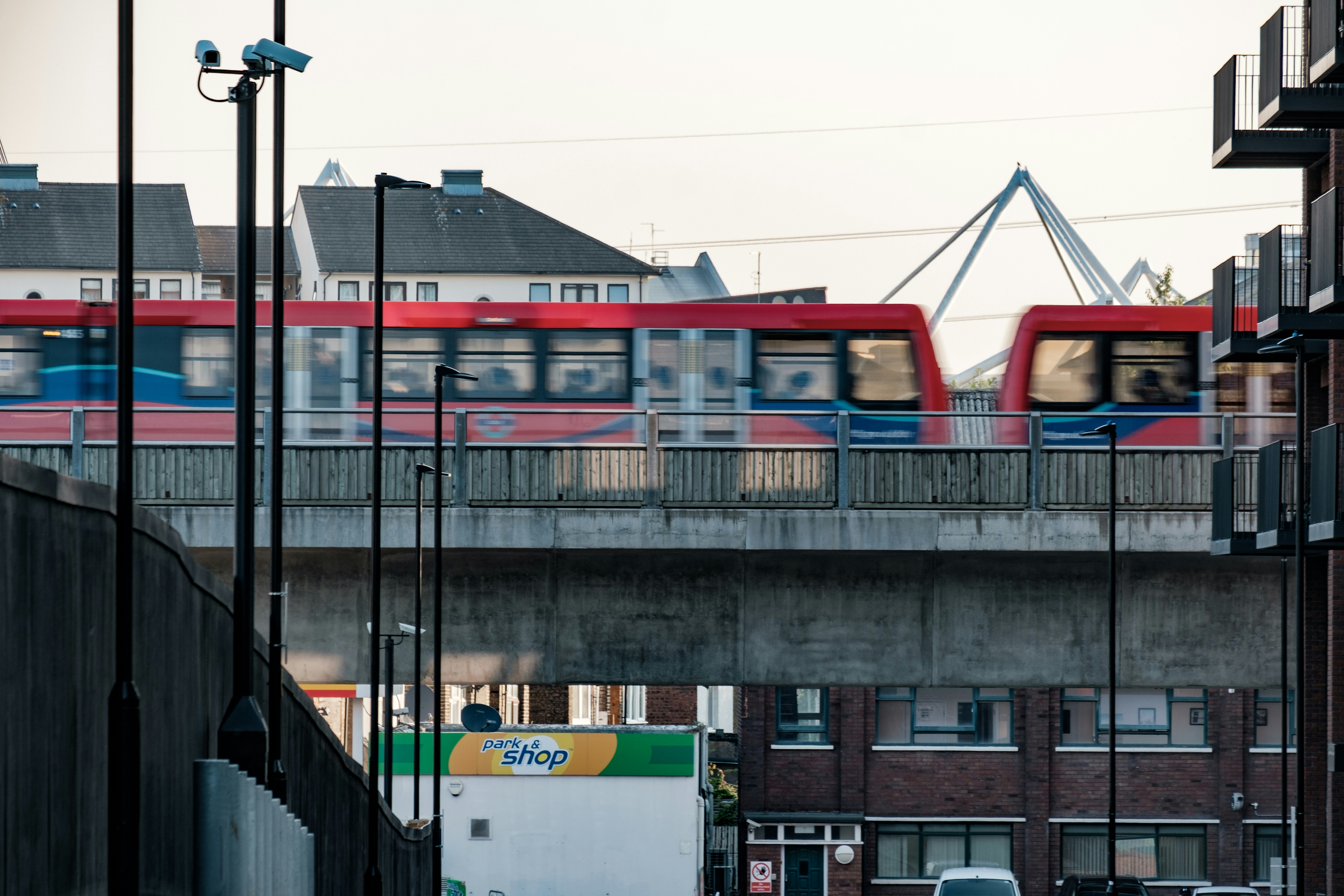 white and blue bus on road near building during daytime